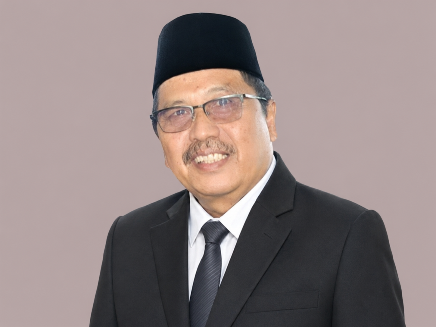 Potret Drs. H. Syafrian Naili, M.Kes